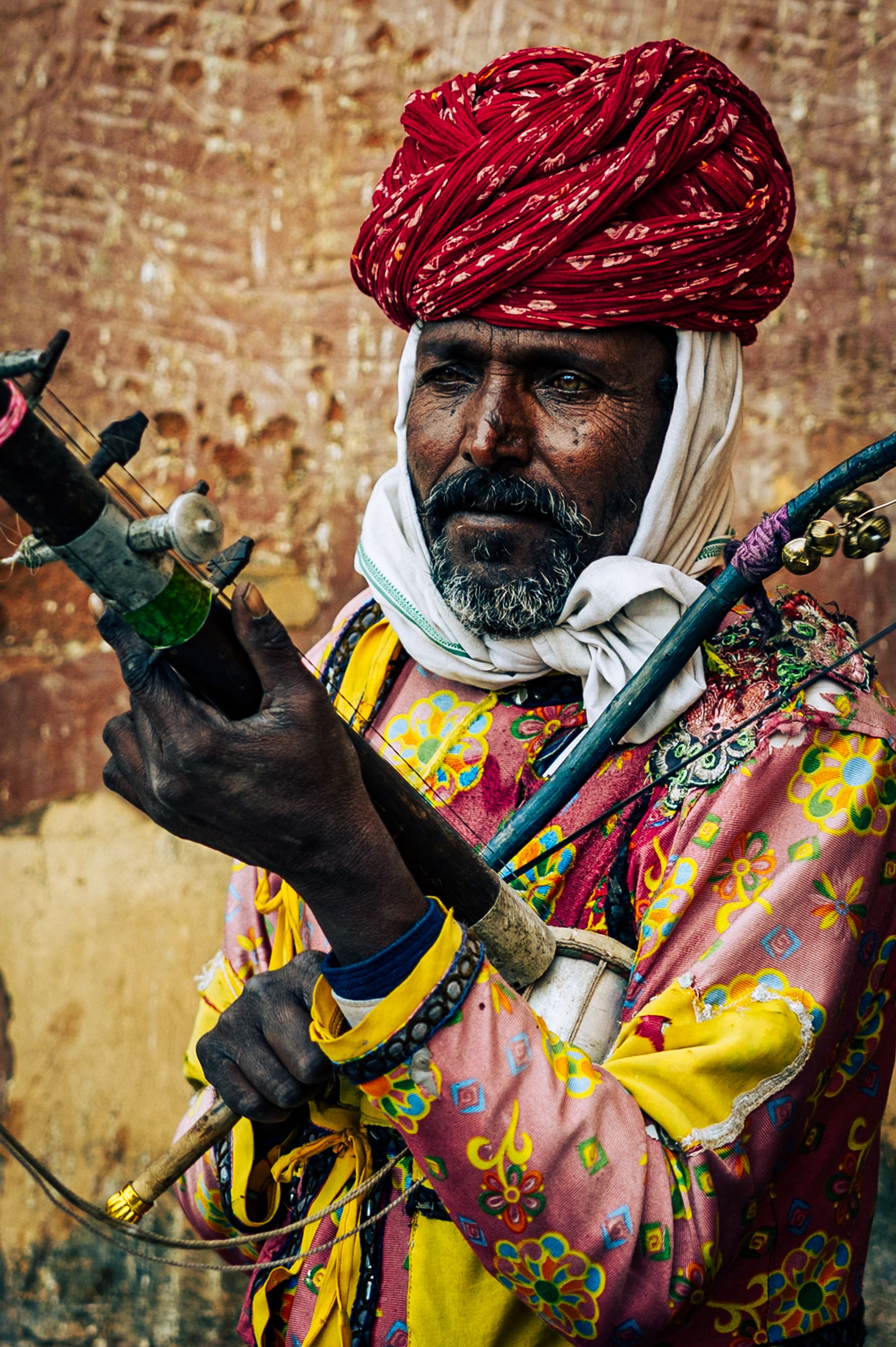 Musician Portrait In Red Turban With Instrument